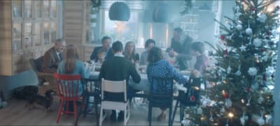 a group of people sitting around a table