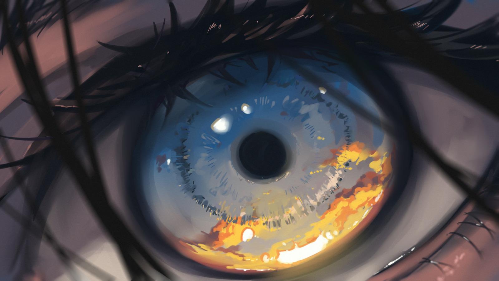a close up of an eye with flames in the iris