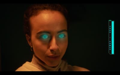 a woman with glowing blue eyes and a thermometer