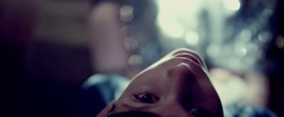 a close up of a person's face with a blurry background