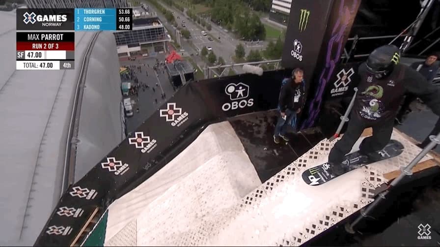 a man riding a skateboard down the side of a ramp