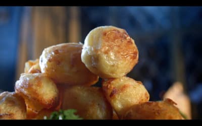 a pile of fried food sitting on top of a table