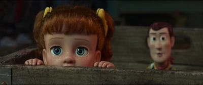 a close up of a doll in a box