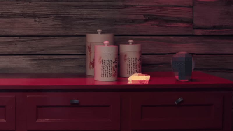 a red table topped with two containers of cheese