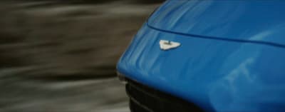 a blue car with a heart shaped sticker on it