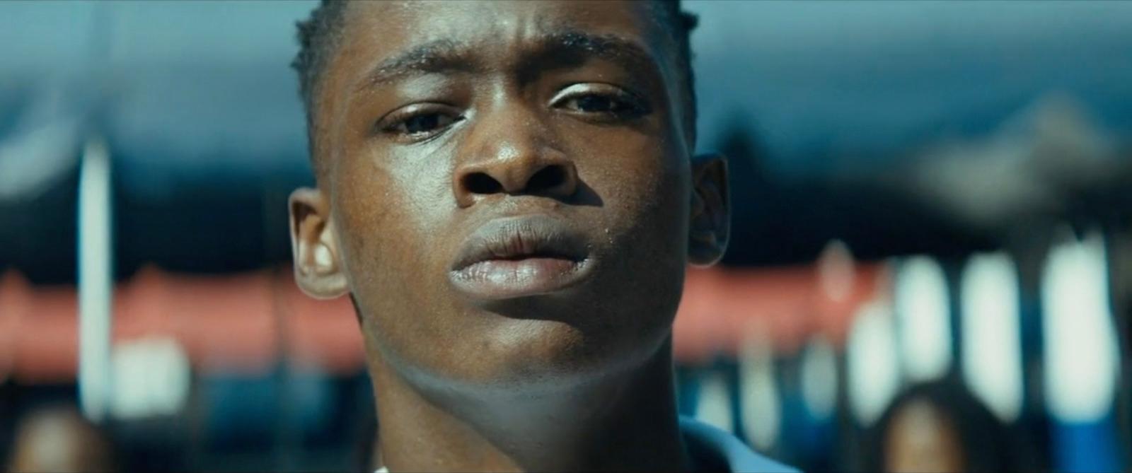 a close up of a person wearing a necklace