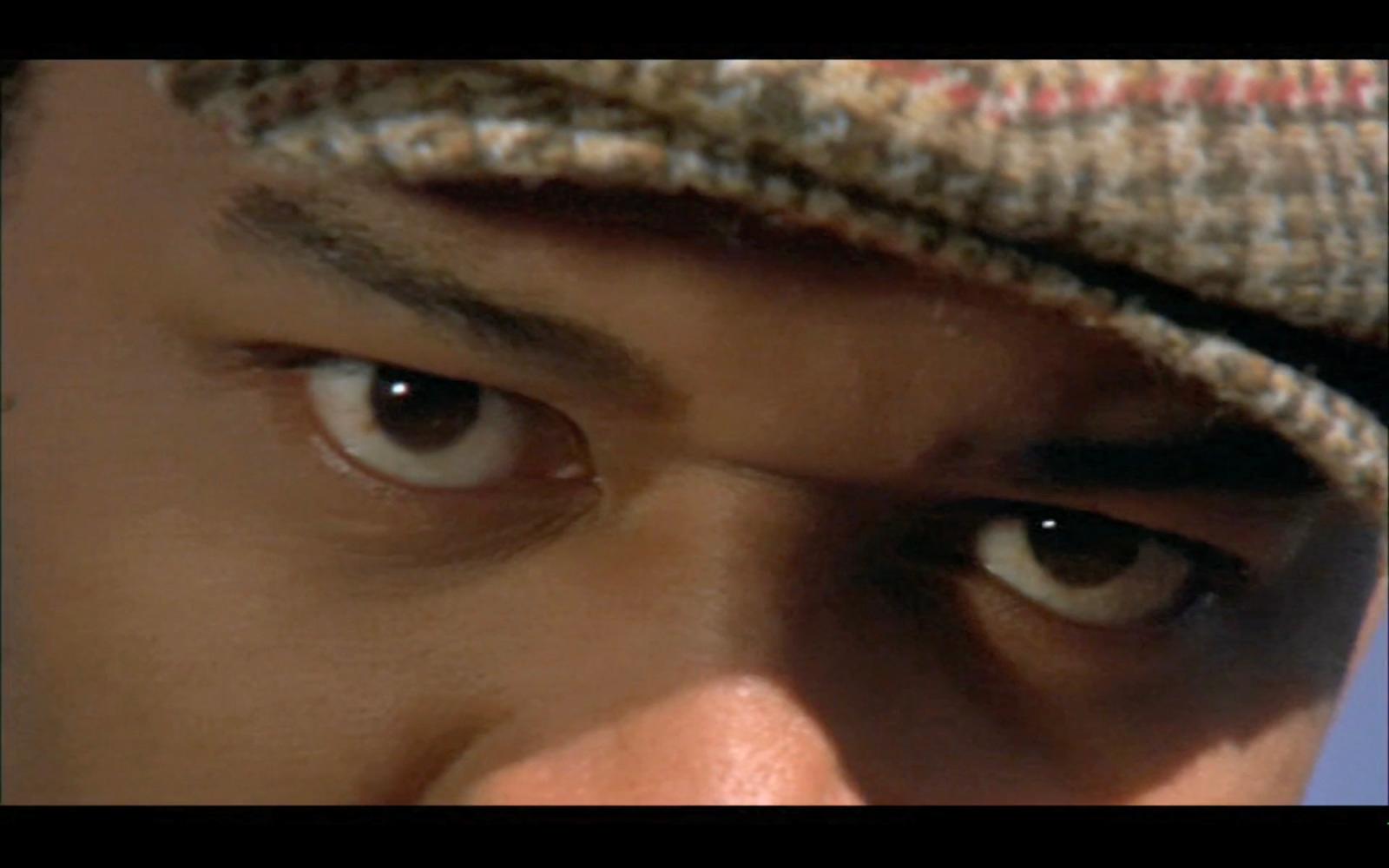 a close up of a person wearing a hat