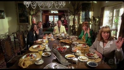 a group of people sitting around a dining table