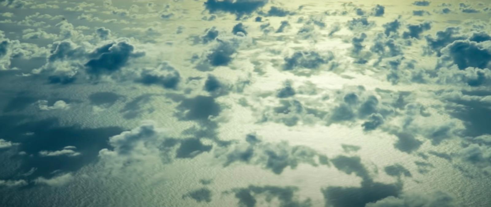 the sun is shining through the clouds in the sky