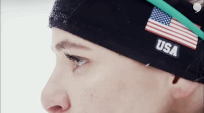 a man with a usa flag on his head