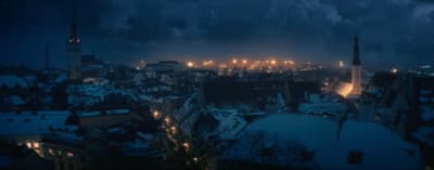 a view of a city at night from a rooftop