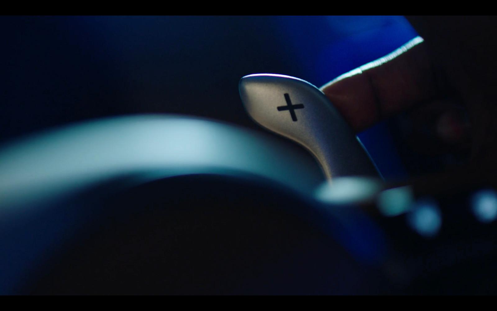 a close up of a person holding a remote control