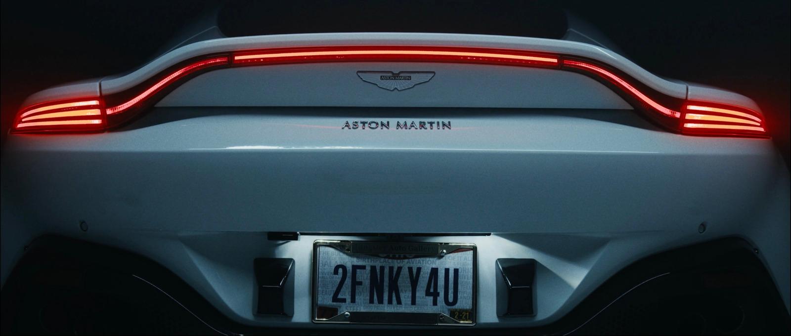 the tail light of a white sports car