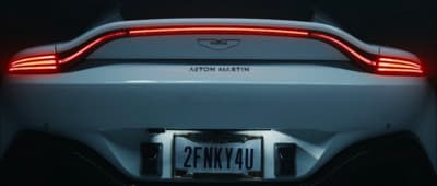 the tail light of a white sports car