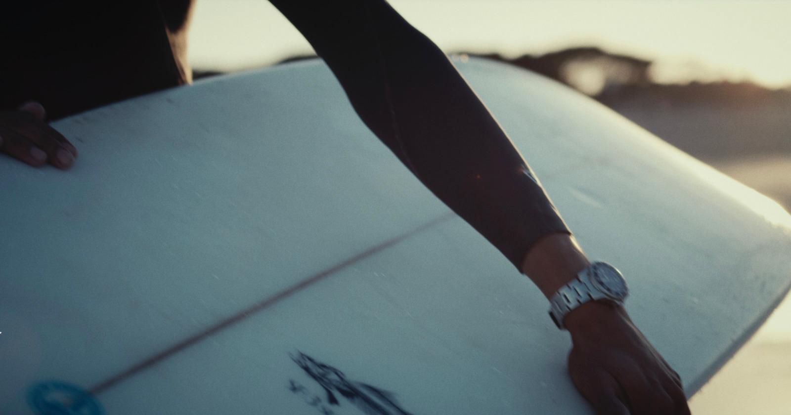 a close up of a person holding a surfboard