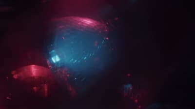 a blurry image of a disco ball in the dark