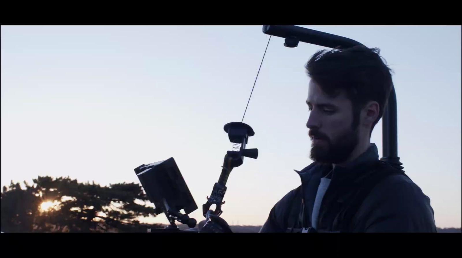a man with a camera attached to his shoulder