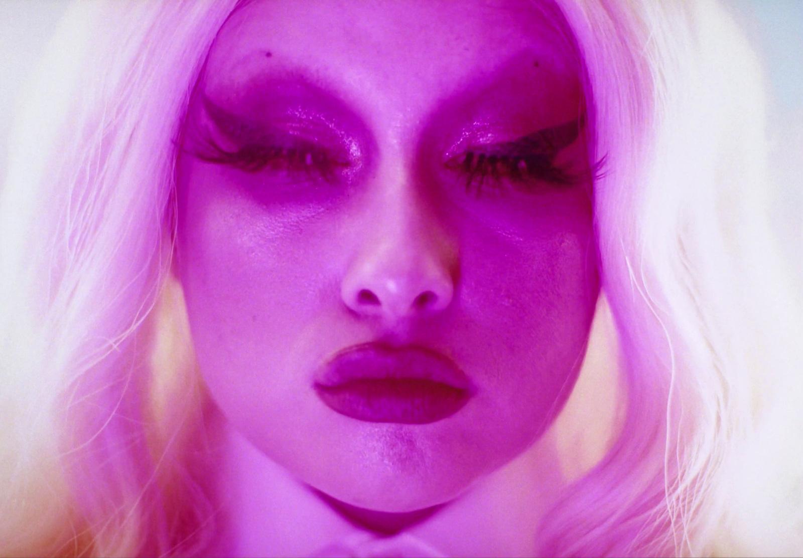 a close up of a person with purple makeup