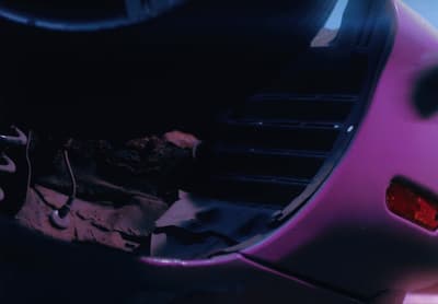 a close up of a purple car with the hood up