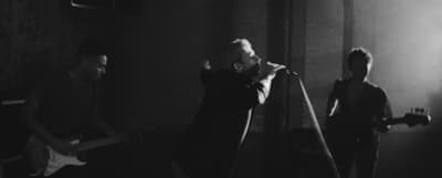 a black and white photo of a band performing