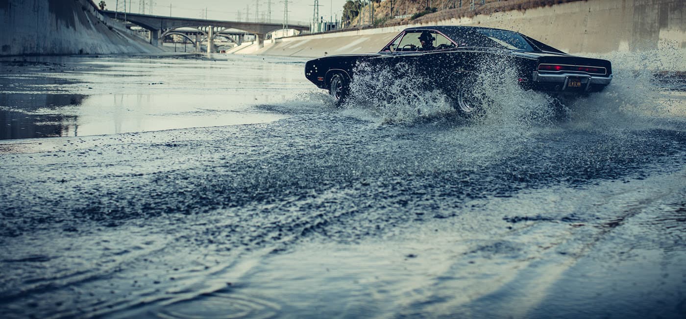 a car driving through a puddle of water