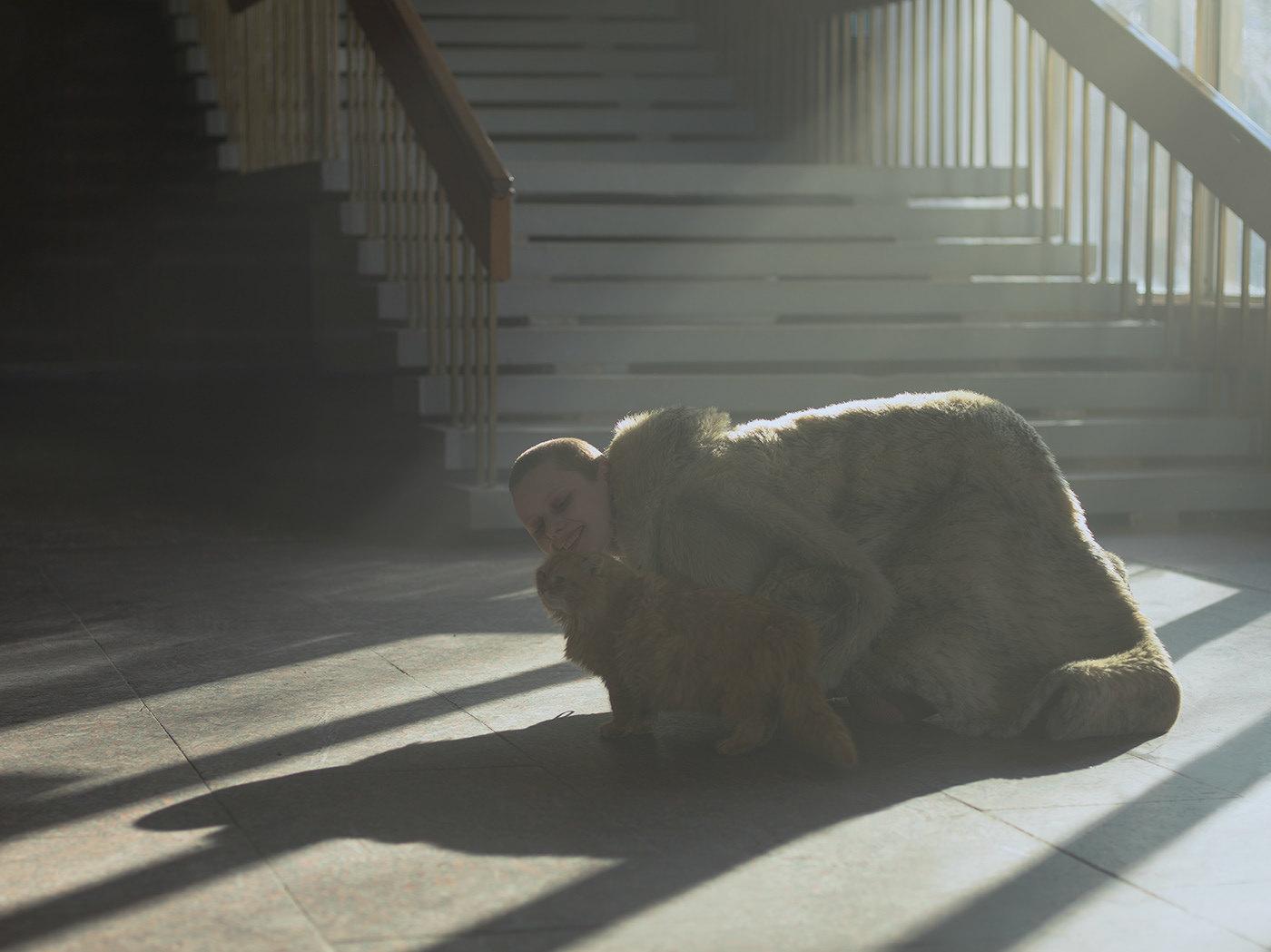 a stuffed animal sitting on the ground next to a stair case