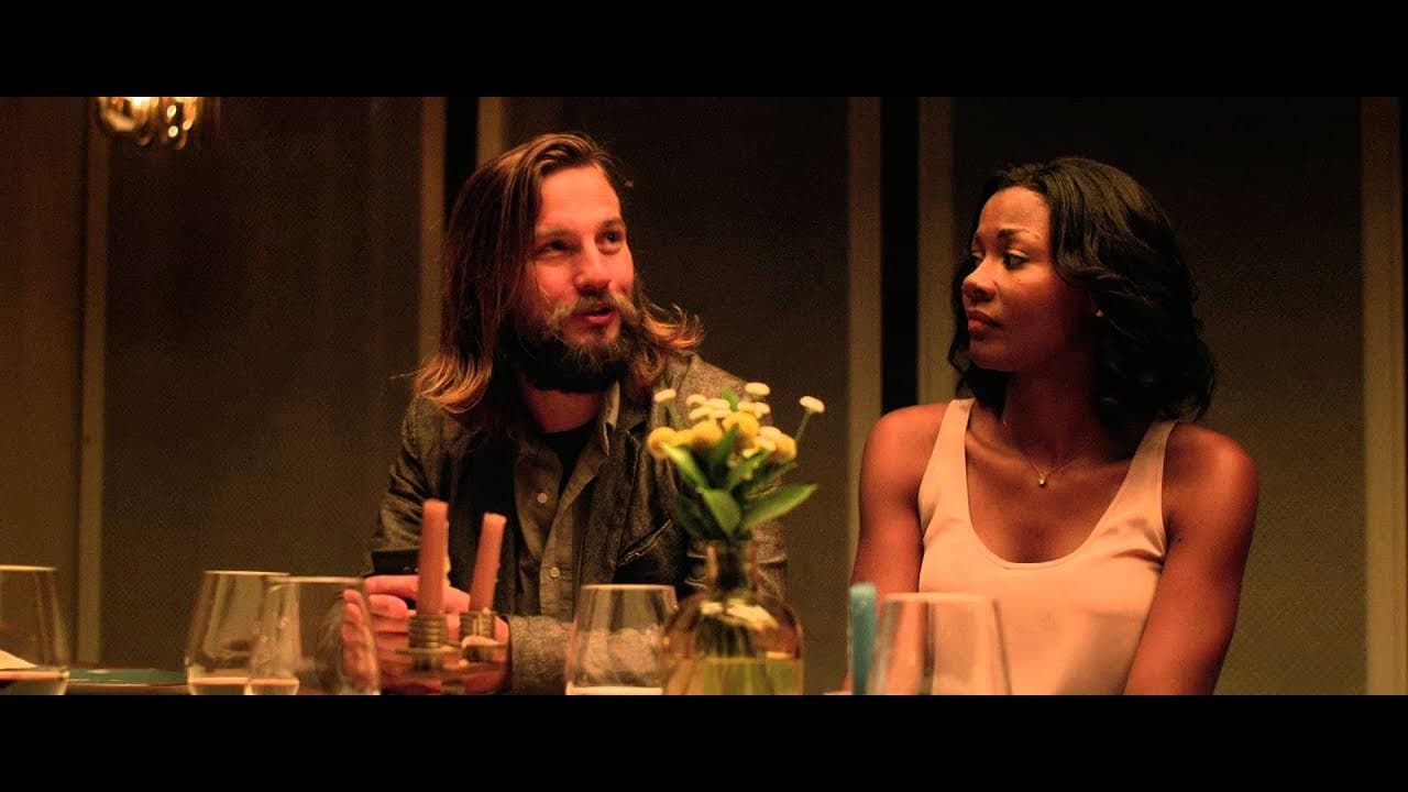 a man sitting next to a woman at a table