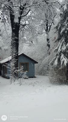 an aerial view of a house in the snow