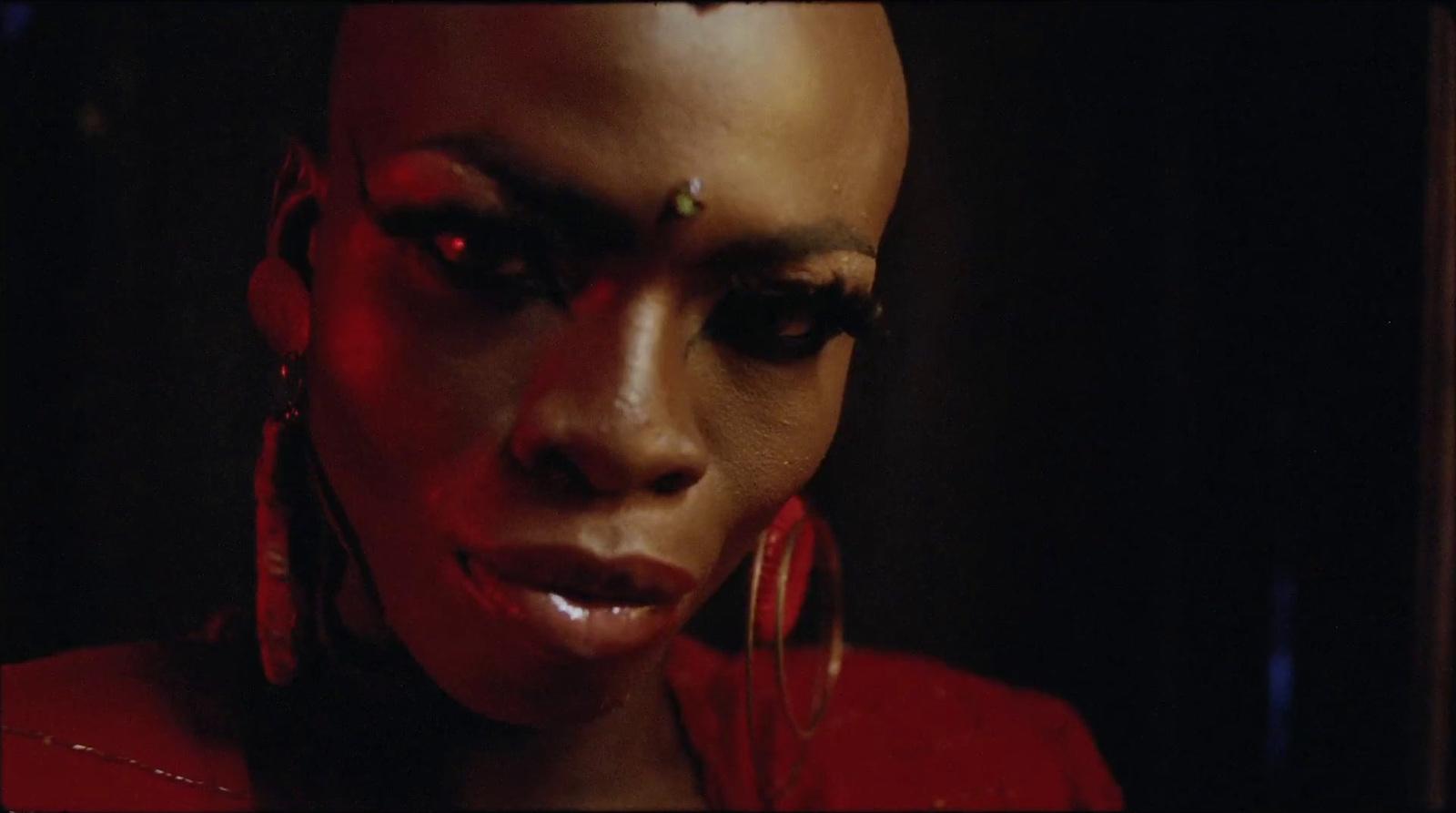 a close up of a person with red makeup