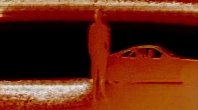 a blurry photo of a bottle of wine