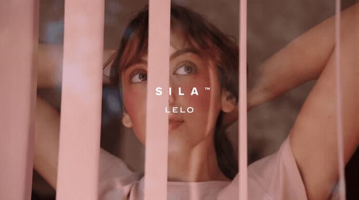 a woman behind bars with the words sila on it