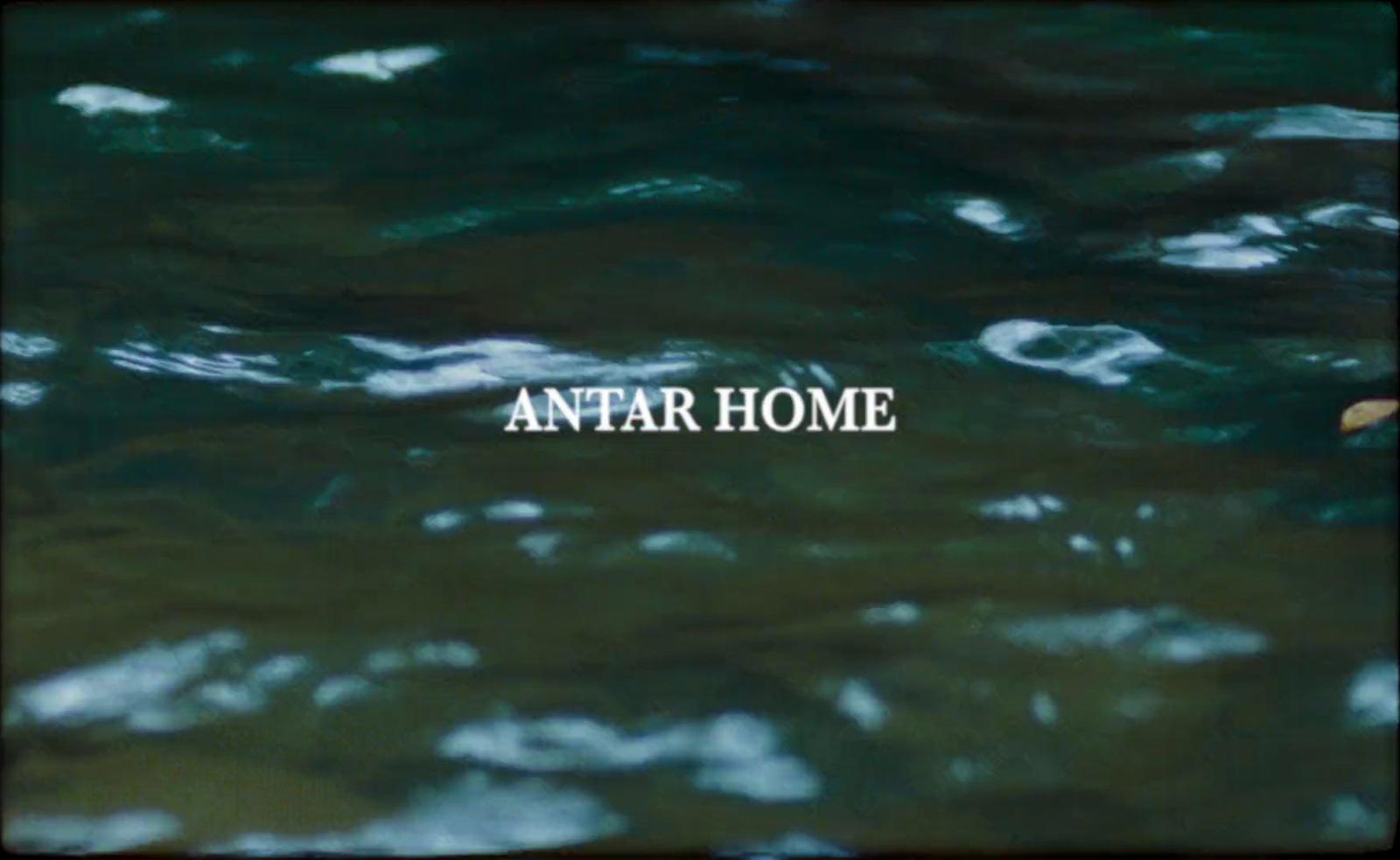 the words antar home are in the water