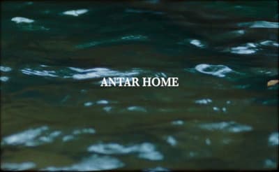 the words antar home are in the water