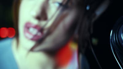 a blurry photo of a woman talking on a cell phone