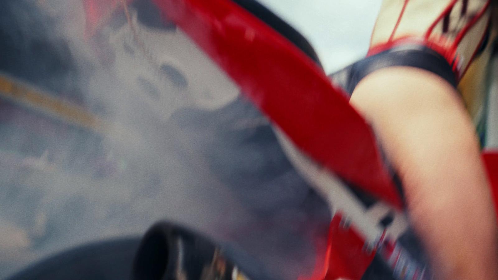 a woman holding a skateboard in her right hand