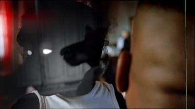 a blurry image of a man's face and torso