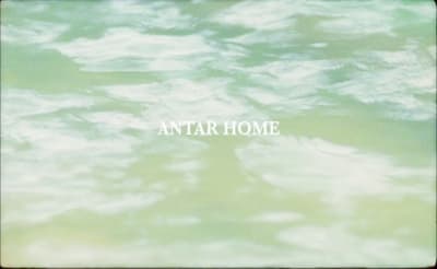 a blurry photo of water with the words antar home