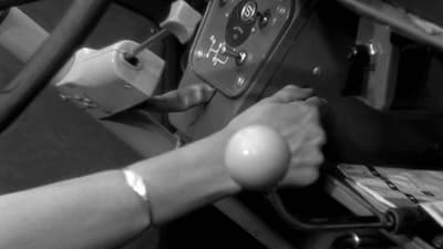 a person is working on a car's steering wheel