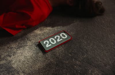 a person laying on the floor next to a sign