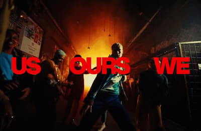 a group of people standing in a room with the words us ourss we