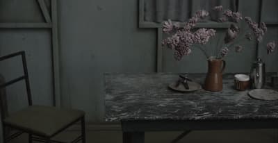 a table with a vase of flowers on it