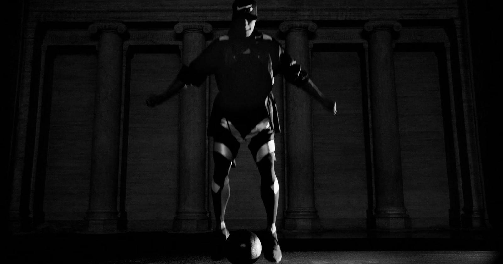 a man standing in front of a building in a black and white photo