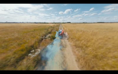 a train traveling through a dry grass field