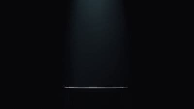 a close up of a black object on a black background