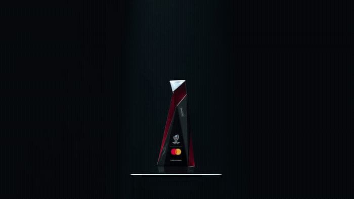 a red and black trophy sitting on top of a table