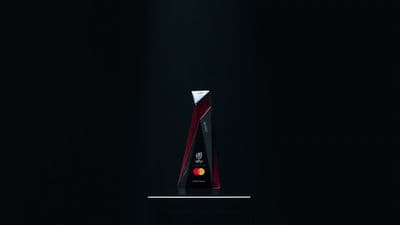 a red and black trophy sitting on top of a table