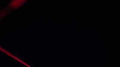 a close up of a red object in the dark