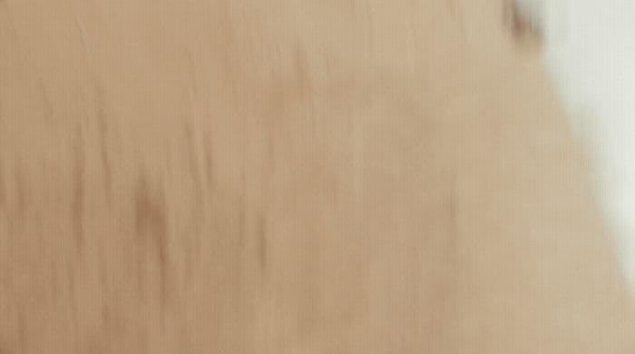 a close up of a wooden surface with a blurry background