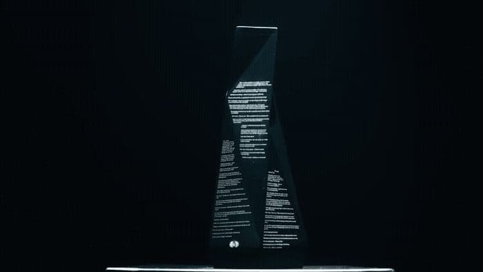 a black and white photo of a tall glass award