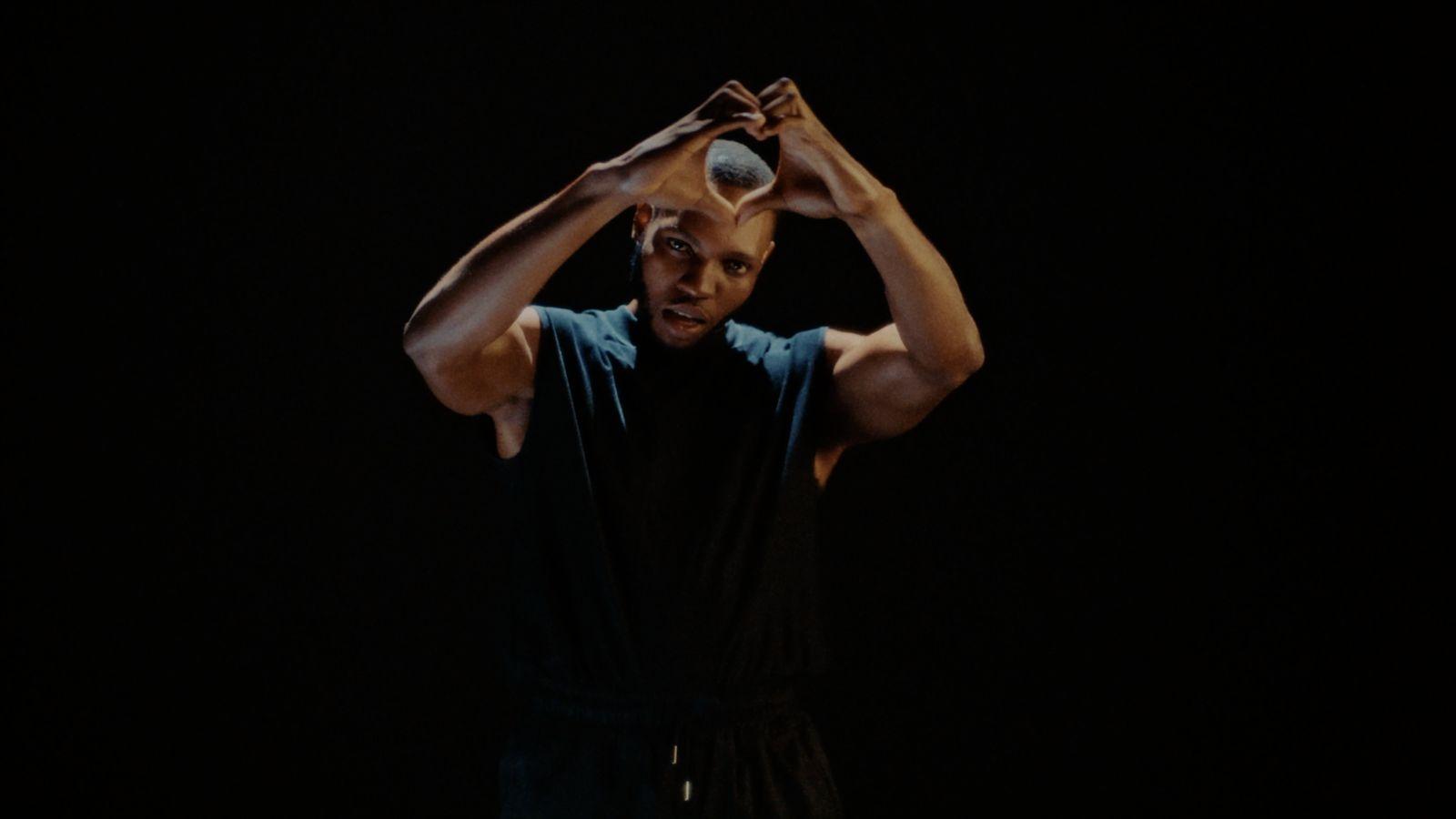 a man is holding his head with his hands